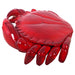 Top side view of big crab statue with detail of red body and crab legs