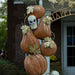 Closeup of top to pumpkin stack with skull. Beautiful  colors and details on iron.