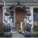 Perfect archway for Halloween cemetery or front door entrance. Black pumpkins and ghosts stacked up with purple LED lights. Cemetery sign across the top.