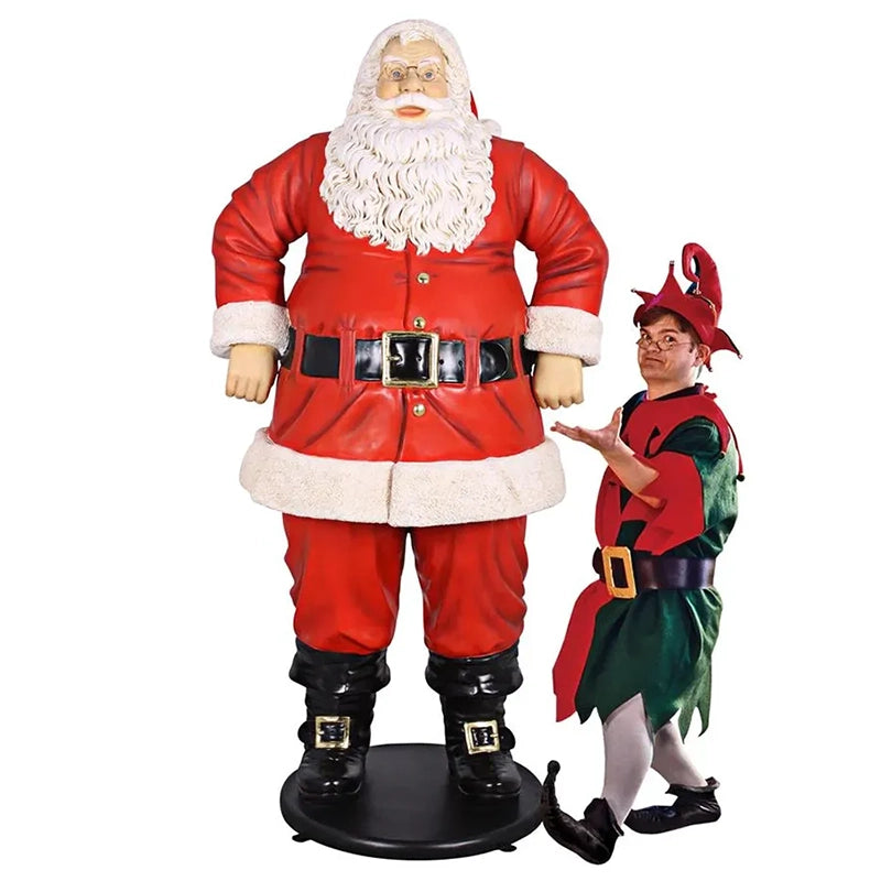 Life Size Santa - 6 Feet - front view - standing beside a small person dressed as Santa's assistant on a white background
