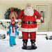 Life Size Santa - 6 Feet - next to a kid - on a porch covered with snow in the background