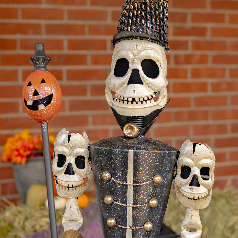 Close up of skeleton soldier with pumpkin staff. skeleton face and shoulders details shown.