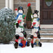 Outdoor Snowman Decoration along with other size front view outside a house with other Christmas ornaments in the background