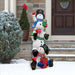 Outdoor Snowman Decoration front view outside a house in the snow