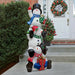 Outdoor Snowman Decoration front view outside a house with other Christmas ornaments in the background