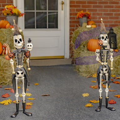 Set of halloween soldier skeletons. One holding a skeleton staff and the other a pumpkin staff. 