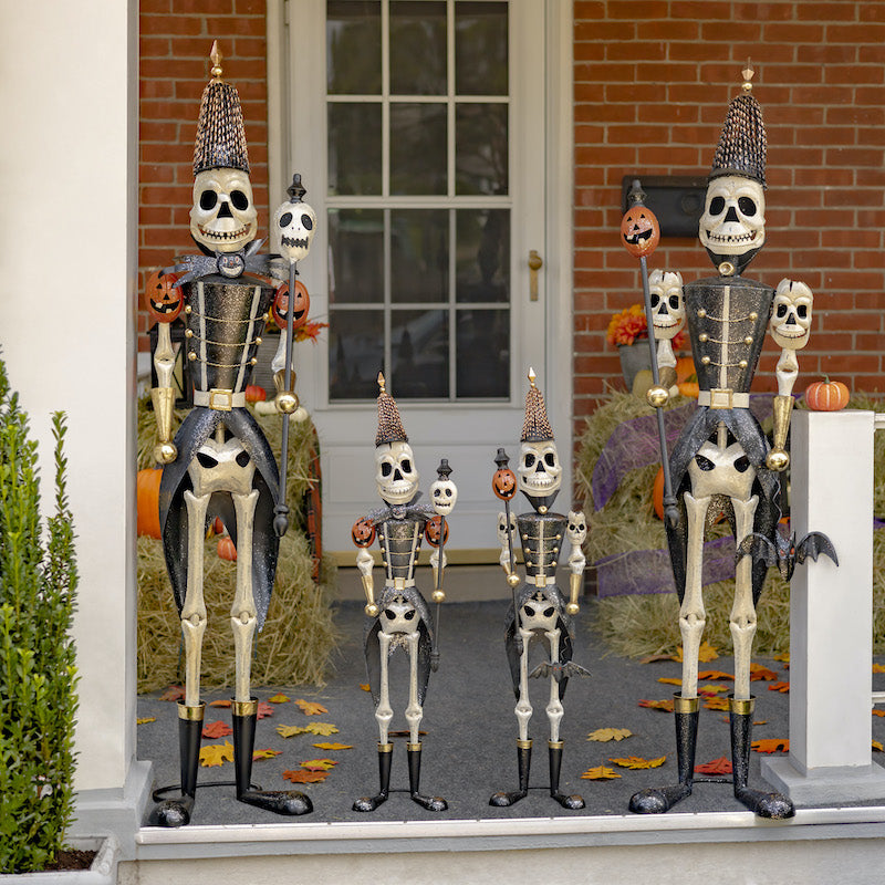 Four skeleton soldiers standing on front porch. Set of two 36" tall soldiers and set of two 63" skeleton soldiers.